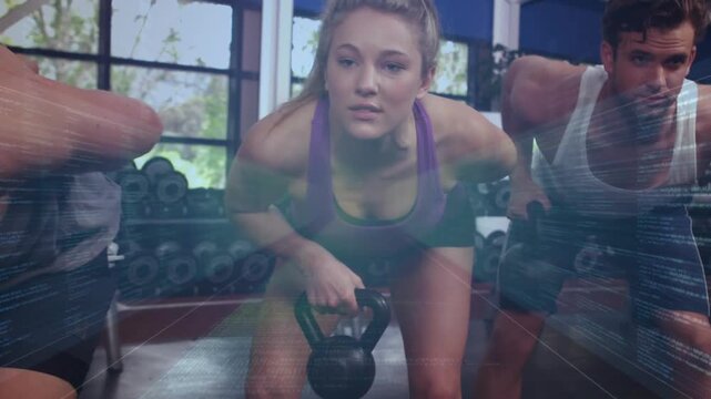 Group gripping kettlebells and doing bent-over rows in gym for fitness with lens flares sweeping