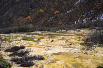 Beautiful scenic Huanglong Valley , a turquoise, calcite-rich pools along the limestone terraces 