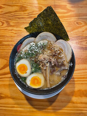 Authentic Tonkotsu Ramen featuring tender, braised Chashu pork and savory Japanese noodles in a creamy pork bone broth