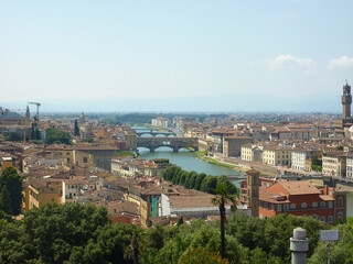 Fototapeta premium Aerial panorama of Florence featuring the Arno River, Ponte Vecchio, and Palazzo Vecchio