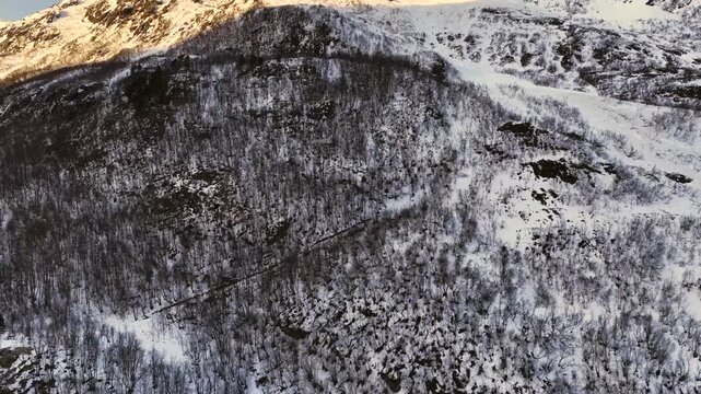 Aerial view of the steep mountainsides lining the rural valley of Oeksendal, near Kristiansund, Norway.
