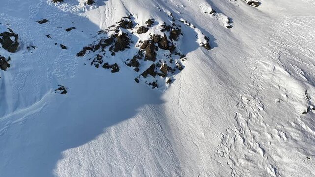 Aerial view of the steep mountainsides lining the rural valley of Oeksendal, near Kristiansund, Norway.