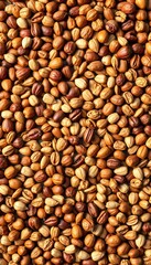 Naklejka premium Overhead view of a textured spread of assorted nuts and seeds, showcasing earthy tones and intricate patterns, clean eating, nuts
