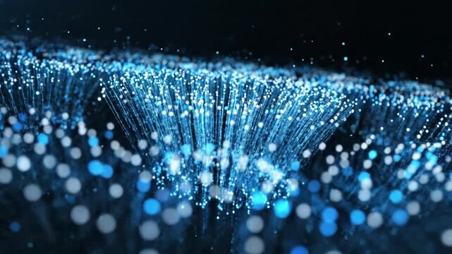 Abstract flowing blue digital particles with light effects on a dark background, representing data or technology