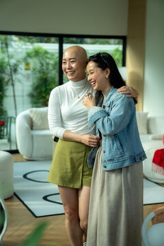 Young woman supporting friend having baldness