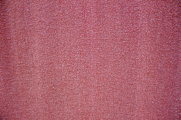 Fototapeta premium Pink cotton bath towel texture with a soft surface and dense fabric fiber pattern.
