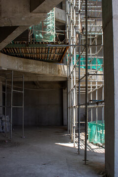 Jakarta, Indonesia - March 16, 2026: Concrete building construction floor area with structural beams and scaffolding in the development stage.