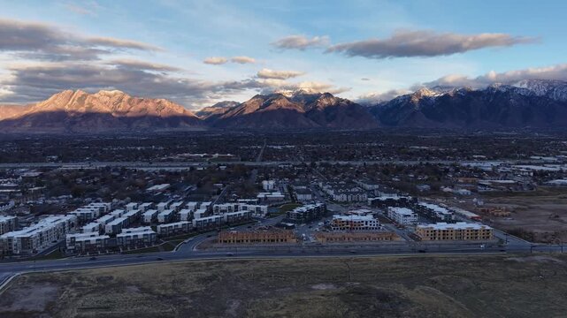 Aerial view of Midvale Utah and sunlit Wasatch Mountains