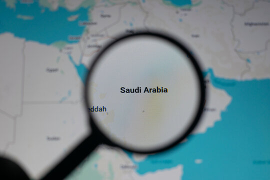 Magnifying glass focusing on Saudi Arabia map highlighting Riyadh and Jeddah, symbolizing Middle East geopolitics, oil export routes, tourism growth, pilgrimage travel, and strategic global trade.