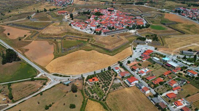 Aerial panoramic view above the old town of the city and fortes Almeida in Portugal on a sunny summer day .