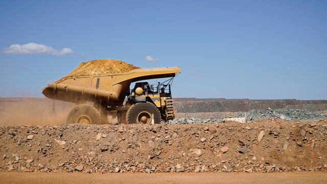 Western Australia mining town of Kalgoorlie a heavy mining dump truck hauling dirt across open pit