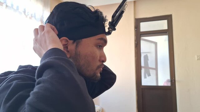 Man Adjusting Head‑Mounted Camera Rig