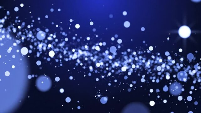 Abstract blue background with sparkling bokeh lights and floating particles forming a cosmic galaxy