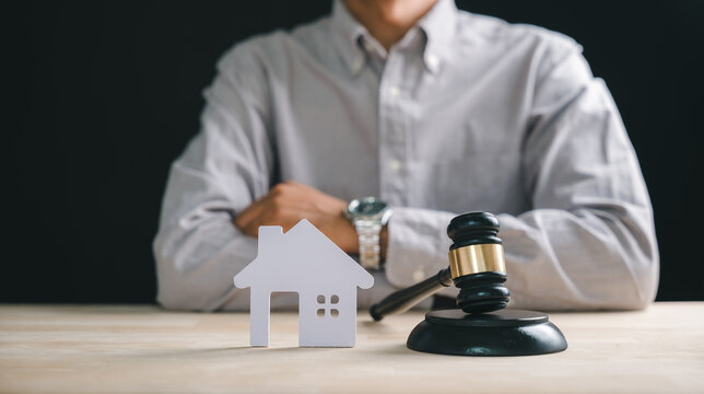 Foreclosure house concept with judge gavel, representing property law, real estate bankruptcy, mortgage debt, home auction, estate sale, legal division, attorney counsel