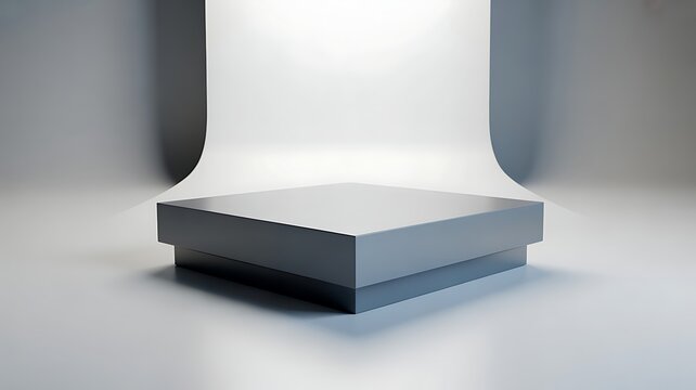 Simple grey square display stage in studio lighting