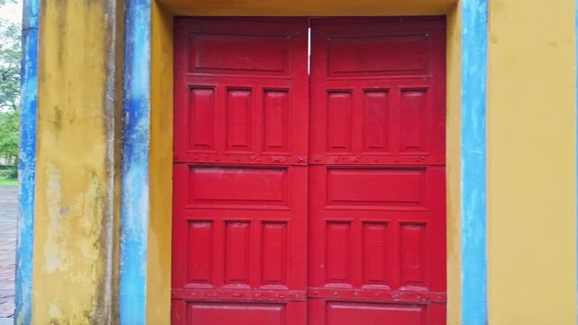 Tourists visit the a Residence, within the Imperial City, a walled enclosure within the city of Hue, Vietnam. People explore the historic site on a cloudy day.