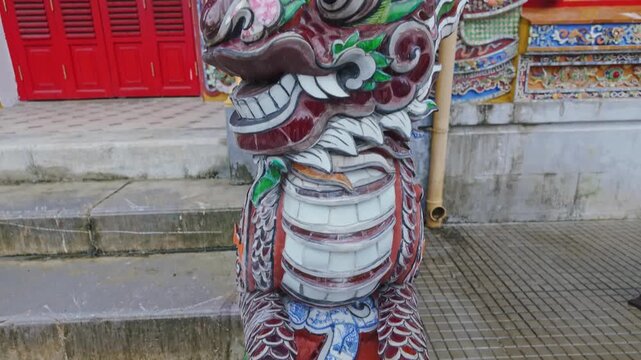 Close-up of a colorful, ornate statue in Hue Imperial City, Hue, Vietnam. The statue is a traditional design