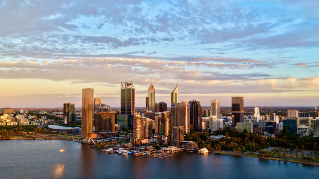 Perth City at Sunrise, Western Australia &ndash; 4K Aerial Drone View of Skyline, Swan River, Central Business District, CBD, Modern Skyscrapers, Waterfront Marina, Swan River and Golden Morning Light