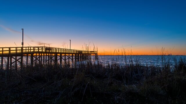 Pier on Mobile Bay at sunset