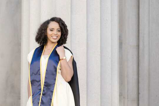 Young woman celebrating graduation milestone on Berkeley campus