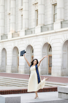 Joyful Berkeley Graduate Celebrating in Front of Campus Arches