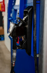 Plakat Close up of fuel nozzle on a gas pump at the gas station.