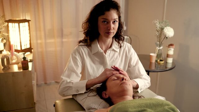 Professional head massage in a serene, relaxing spa environment.