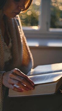Woman reading the Bible &mdash; quiet moment of reflection, vertical footage