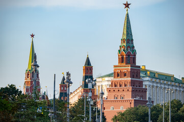 Fototapeta premium Moscow Kremlin towers featuring red stars against a clear blue sky