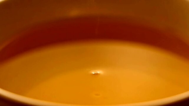Golden Brew: An abstract image of a full, warm-toned mug. A captivating close-up of the delicious drink.