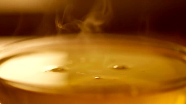 Steaming Tea: A close-up shot of a steaming cup of tea, the warm hues of the liquid creating a sense of coziness and relaxation. 