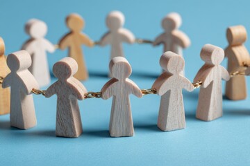 Unity in Solidarity: Wooden figures form a circle, hands joined in a powerful symbol of connection, collaboration, and collective strength, reflecting the essence of teamwork and shared purpose.