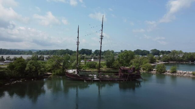 La Grande Hermine, the Jordan Harbour Shipwreck, an old tall ship relic along the QEW in Ontario, Canada, on Lake Ontario. Aerial shot at a low altitude, moving forward. 2021.