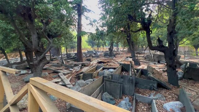 Cinematic 4k video of ancient Kalash Wooden Coffins in an Open Air Graveyard, Bumburet Valley, Chitral, Pakistan, Cinematic Pull Back Shot
