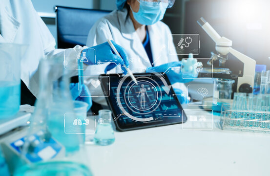 Scientist conducting medical research in modern laboratory using digital healthcare interface, biotechnology analysis, pharmaceutical testing