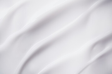 Obraz premium Smooth white cream texture forming elegant flowing waves and swirls