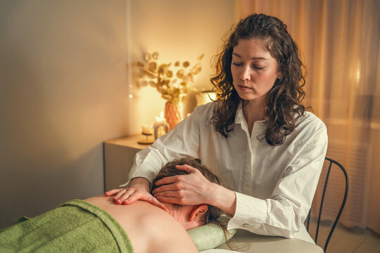 Professional head massage in a serene, relaxing spa environment.