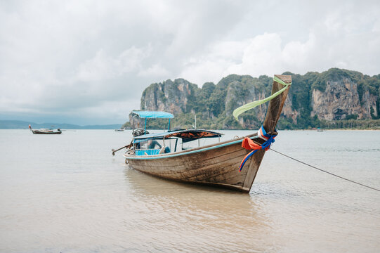 Traditional long tail boat anchored at Railay West Beach in Krabi