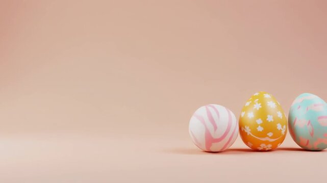 Colorful Patterned Easter Eggs Rolling on Pastel Peach Background