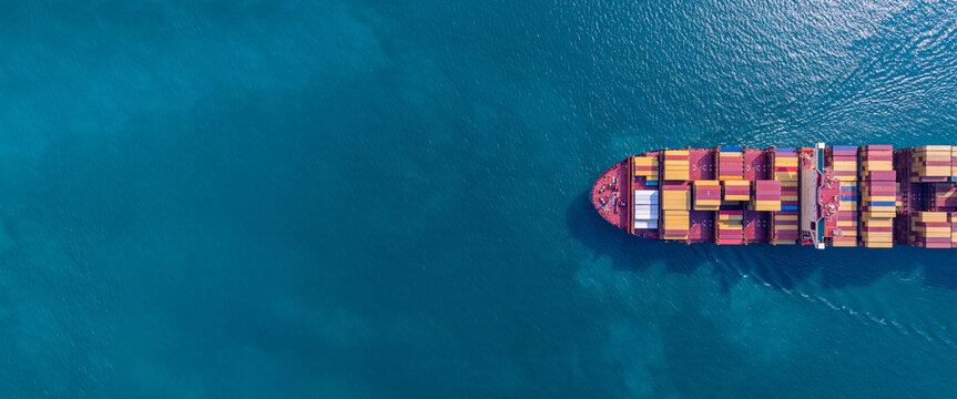 Aerial view from drone, Container ship or cargo shipping business logistic import and export freight transportation by container ship in open sea, Container loading cargo freight ship boat.