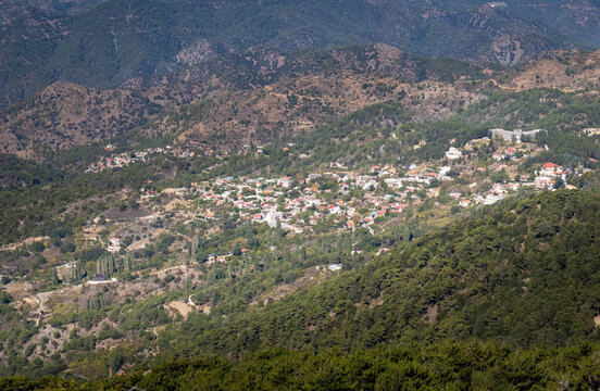 Top view of prodromos village nestled among green hills and pine forests in the troodos mountains, showing traditional architecture and a scenic view