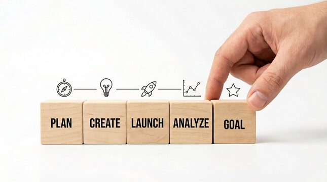 Strategic planning concept: Hand placing goal block on wooden cubes.