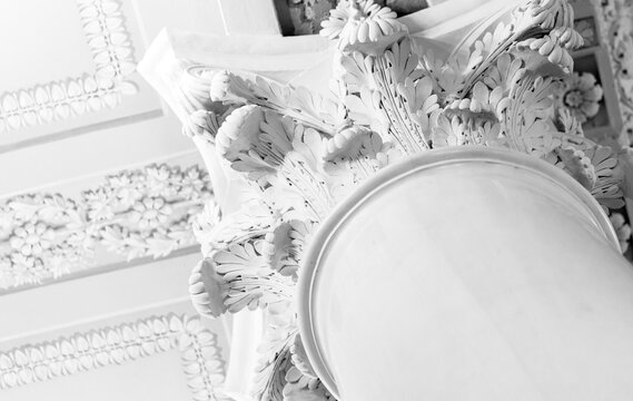 Classical decorative architecture close up photo. Intricate Corinthian capital, abstract white architecture background photography