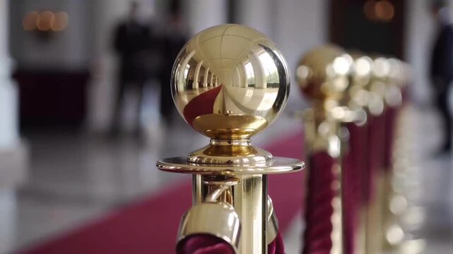 Golden Stanchion With Red Rope And Red Carpet pole brass