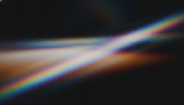 A blurry image of a rainbow colored light beam