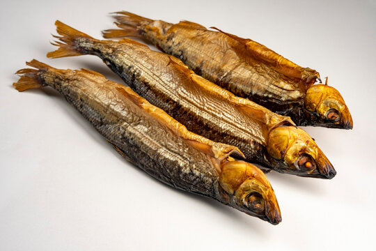 Hot smoked fish Baikal omul Coregonus autumnalis on white background