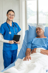 Obraz premium A male cancer patient on bed receives IV therapy while a female doctor offers care encouragement and updates on his test results providing support and discussing health progress