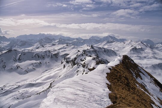 View from the summit of Hochfinsler between the cantons of St. Gallen and Glarus. Ski tour in the Swiss mountains.