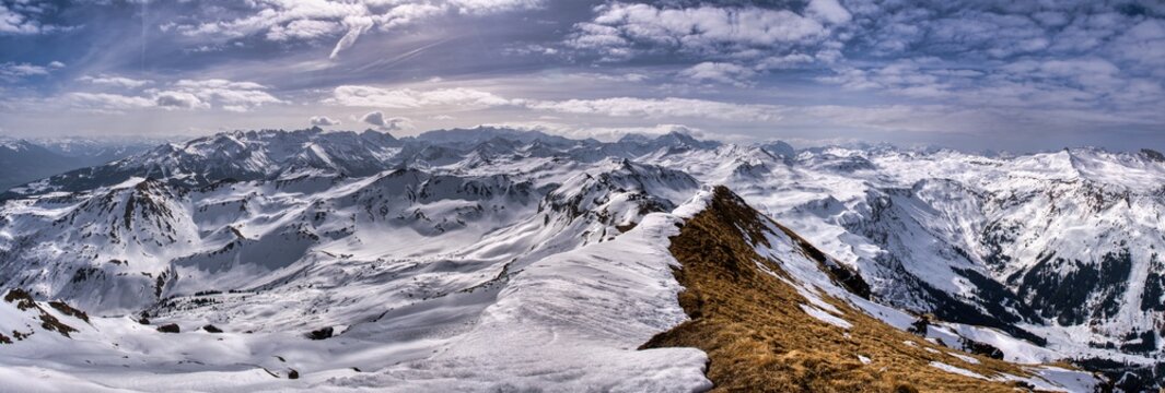 View from the summit of Hochfinsler between the cantons of St. Gallen and Glarus. Ski tour in the Swiss mountains.