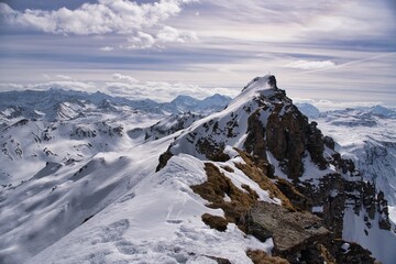 Obraz premium Ski ascent of Hochgamatsch mountain in the Sarganserland region of Heidiland. With views of the Hochfinsler. Ski tour in the Swiss Alps with a fantastic mountain panorama. Ski mountaineering.